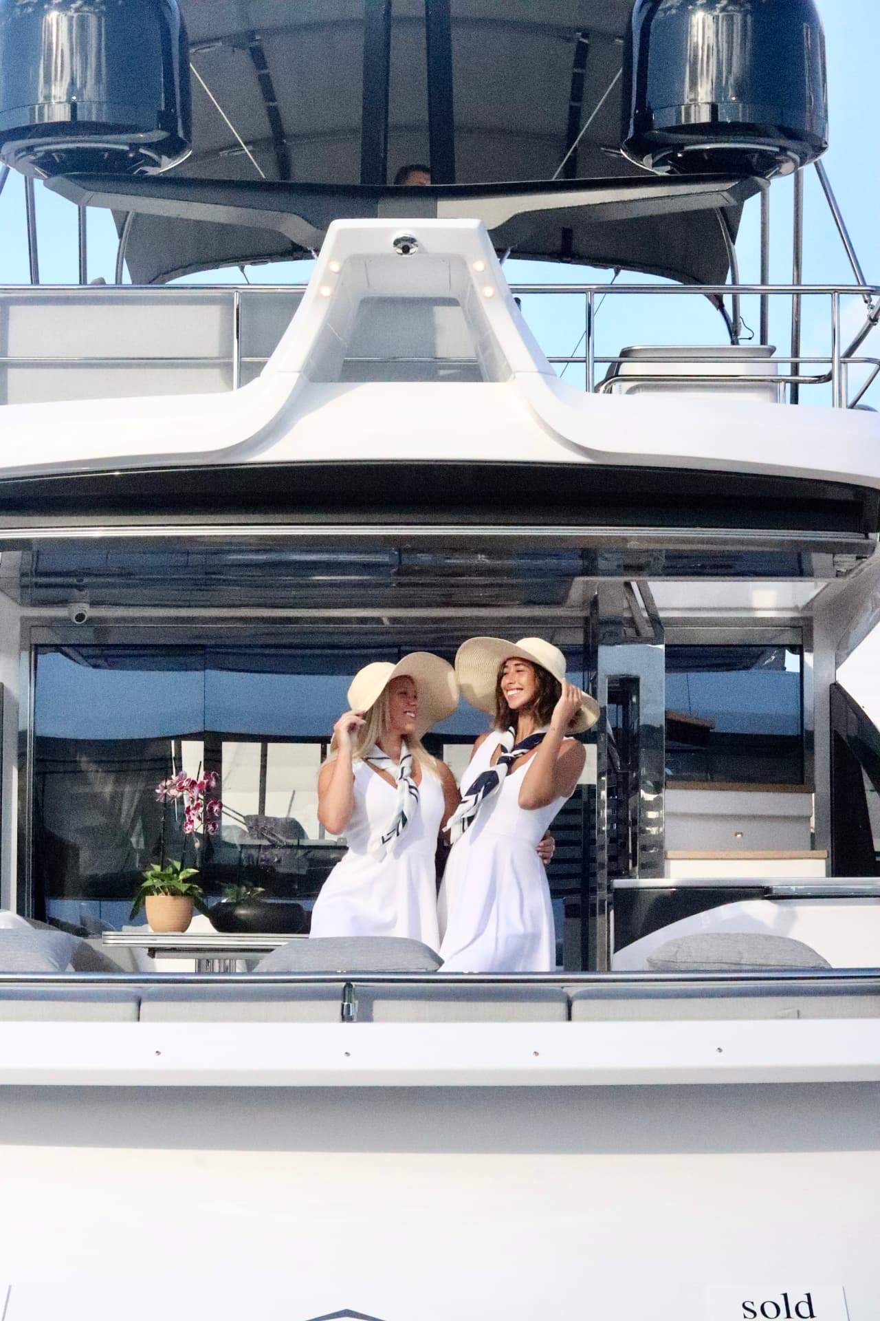 Boat show hostesses on the flybridge